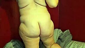 Pregnant milf rips clothes to strip, showing erect nipples.