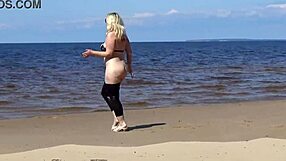 Big leather ass strolls beach in heels and naked