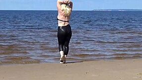 Big leather ass strolls beach in heels and naked