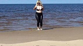 Big leather ass strolls beach in heels and naked