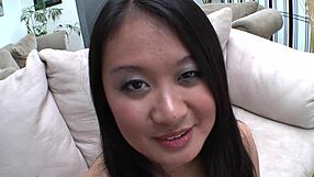 plump asian wets the couch with her squirt during an intense fingering and fucking