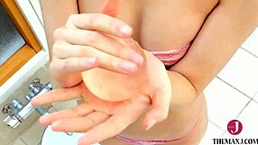 Hey, that cute Japanese babe in micro bikini bursts water balloons wet!