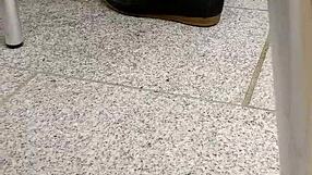 intense shoeplay and toe dipping with tan nylons and flats on the floor