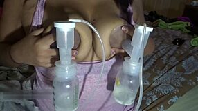 Milf's big lactating tits pumped hard and milked