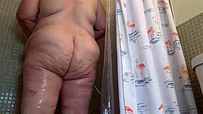 Chubby SSBBW woman showering and flashing natural tits