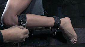 breastbondage sub restrained on a sex machine