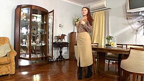 busty redhead reveals her hairy pussy to the camera in homemade solo tease