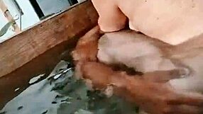 Wife Comforting Husband's Friend With Subtle Touches And Whispers