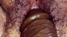 Watch this fat hairy pussy get fist fucked up close, squirting everywhere!