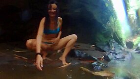 exotic couple fucks wildly in tropical rain, reaching orgasm deep in jungle
