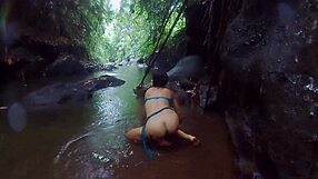 exotic couple fucks wildly in tropical rain, reaching orgasm deep in jungle