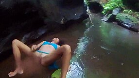 exotic couple fucks wildly in tropical rain, reaching orgasm deep in jungle