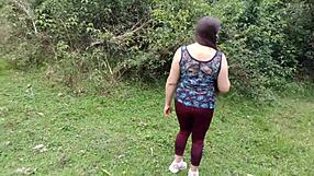 Amateur mother-in-law exhibits in the forest with stepson