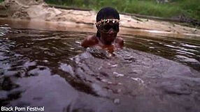 Skinny dark-skinned african hottie teases in the water