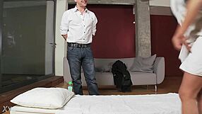 Therapist oils up for rough anal massage session