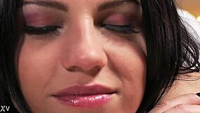 Therapist oils up for rough anal massage session