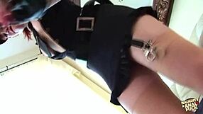 redhead police officer in high heels performs striptease on couch