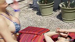 lesbian milf sneaks licks on bikini teen's pussy during sunbathing