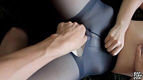 i demonstrate a footjob technique through a hole in pantyhose