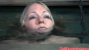 Restrained Sub Punished With Water Bondage In Garage