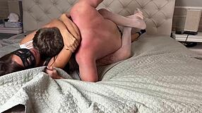 mixed wrestling on the bed she tries to tie his hands