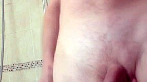 Why not bash those huge swinging balls while stroking that thick cock?