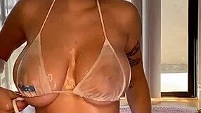 gabbie carter's massive oiled tits get rubbed and squeezed in steamy massage action.