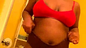 sexy ebony babe with bangs dances close-up shaking big ass before pissing pee stream