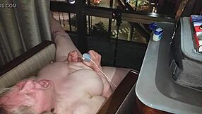 wanna see this naked granny masturbating wildly in the hotel window at night?