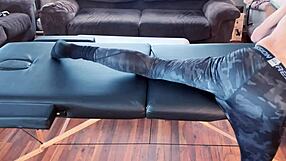 Bodybuilder stretches in tight leggings on massage table hd