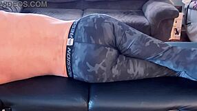 Bodybuilder stretches in tight leggings on massage table hd