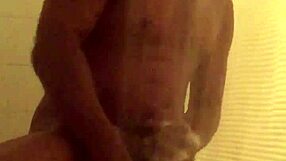 Solo woman trims her smooth body while bathing sensually in steamy shower