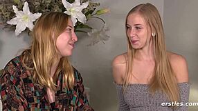 Blonde lesbian grinds and fingers her shaved friend's wet pussy