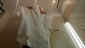 spy cam catches blonde flashing huge tits and ass under skirt in dressing room