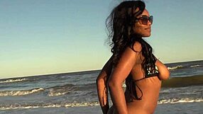 Ebony big ass strips naked on public beach