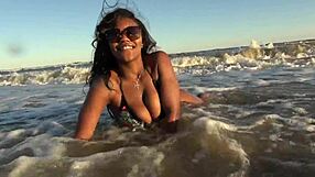 Ebony big ass strips naked on public beach