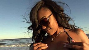 Ebony big ass strips naked on public beach