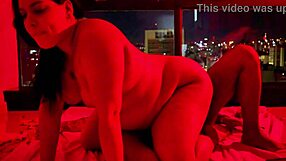 Chubby babe rides huge black cock reverse cowgirl in red light glow!