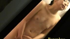 Asian babe fingers her sudsy shaved pussy outdoors in public shower