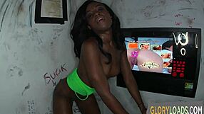 Ebony babe gulps massive interracial cock at gloryhole!