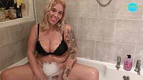 hey check out this horny milf wife masturbating her wet tits in bubbly tub