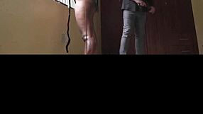 blindfolded woman in tight black leggings moans from punishment indoors