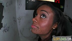 Ebony babe gulps massive interracial cock at gloryhole!