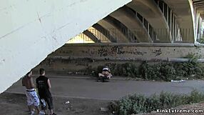 Blonde bound tight in latex endures public domination outdoors