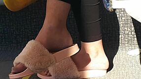 check out this cute brunette's feet slipping in and out of pink slides all candid on the train