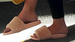 check out this cute brunette's feet slipping in and out of pink slides all candid on the train