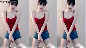 cute chinese girl dances up and down seductively