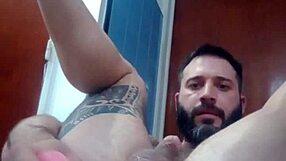 what happens when tattooed ass gets dildo fucked in kitchen?