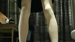Femboy strokes off in black dress
