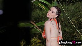 elizabeth marxs inked teen bares massive natural tits tropical forest striptease